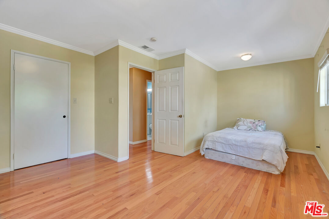 448 West 64th Street Inglewood, CA 90302 - Photo 25 of 39 a spacious bedroom with a bed and a dresser