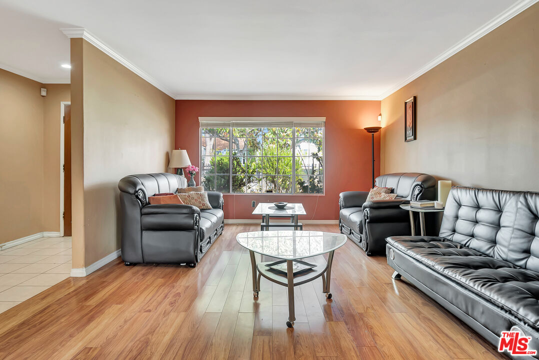 448 West 64th Street Inglewood, CA 90302 - Photo 4 of 39 a living room with furniture and a wooden floor