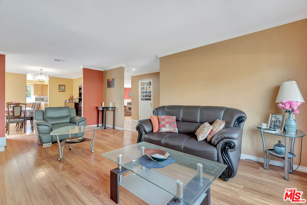 448 West 64th Street Inglewood, CA 90302 - Photo 5 of 39 a living room with furniture and wooden floor