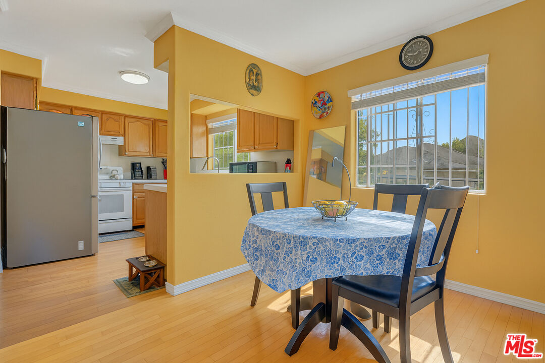 448 West 64th Street Inglewood, CA 90302 - Photo 10 of 39 a dining room with furniture and window