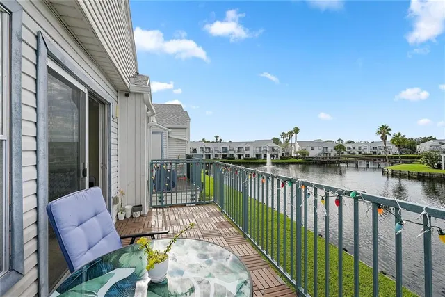 a view of balcony with furniture
