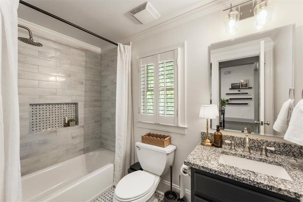 3910 Two Rivers Drive Cumming, GA 30041 - Photo 15 of 110 a bathroom with a granite countertop tub a sink and a large mirror