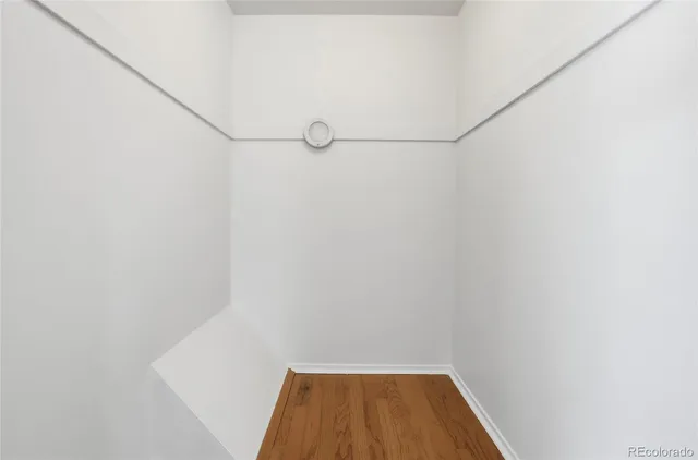 a view of a room with racks on the wall