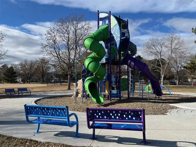 a view of a bench in a back yard