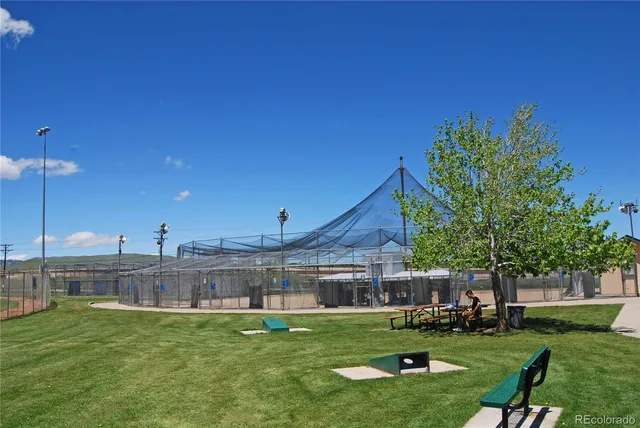 a view of a house with a yard porch and sitting area