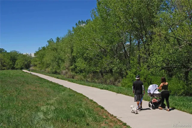 a backyard of a house with a yard and outdoor seating
