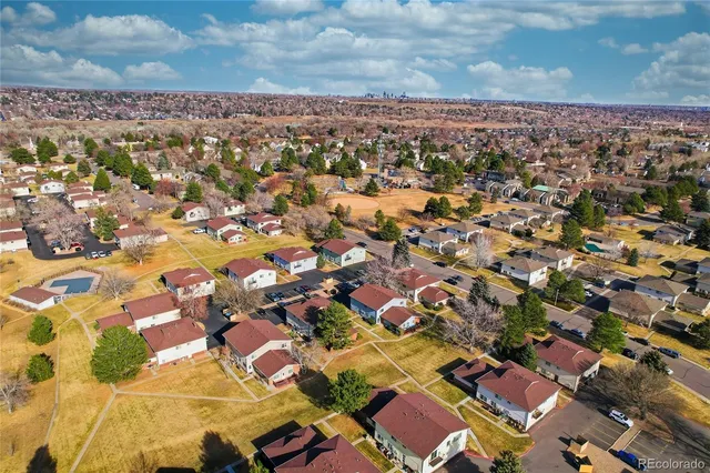 an aerial view of residential houses with outdoor space