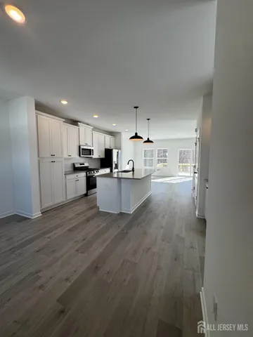 a view of kitchen with wooden floor