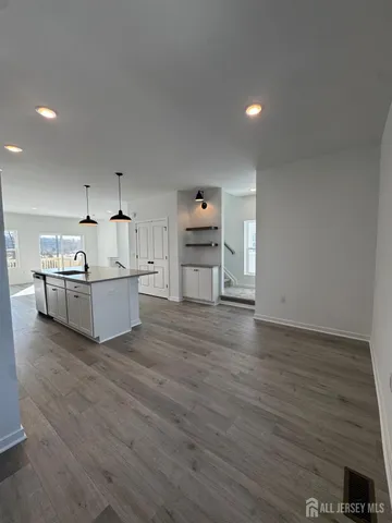 a view of a kitchen with sink and cabinet