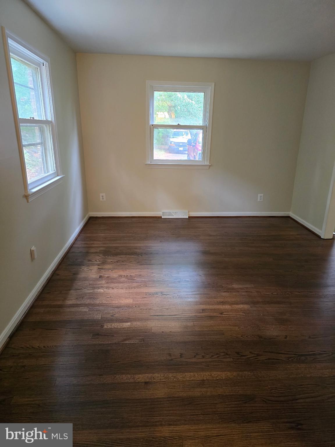 439 Ridgemore Street Fredericksburg, VA 22405 - Photo 5 of 17 an empty room with wooden floor and windows