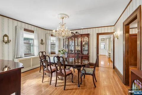 a kitchen with stainless steel appliances granite countertop a sink a stove and cabinets