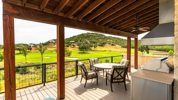 a view of an outdoor dining space with furniture