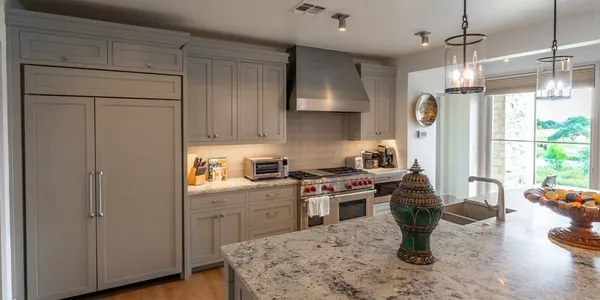 a kitchen with a stove and a refrigerator