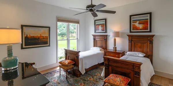 a living room with furniture a window and a flat screen tv