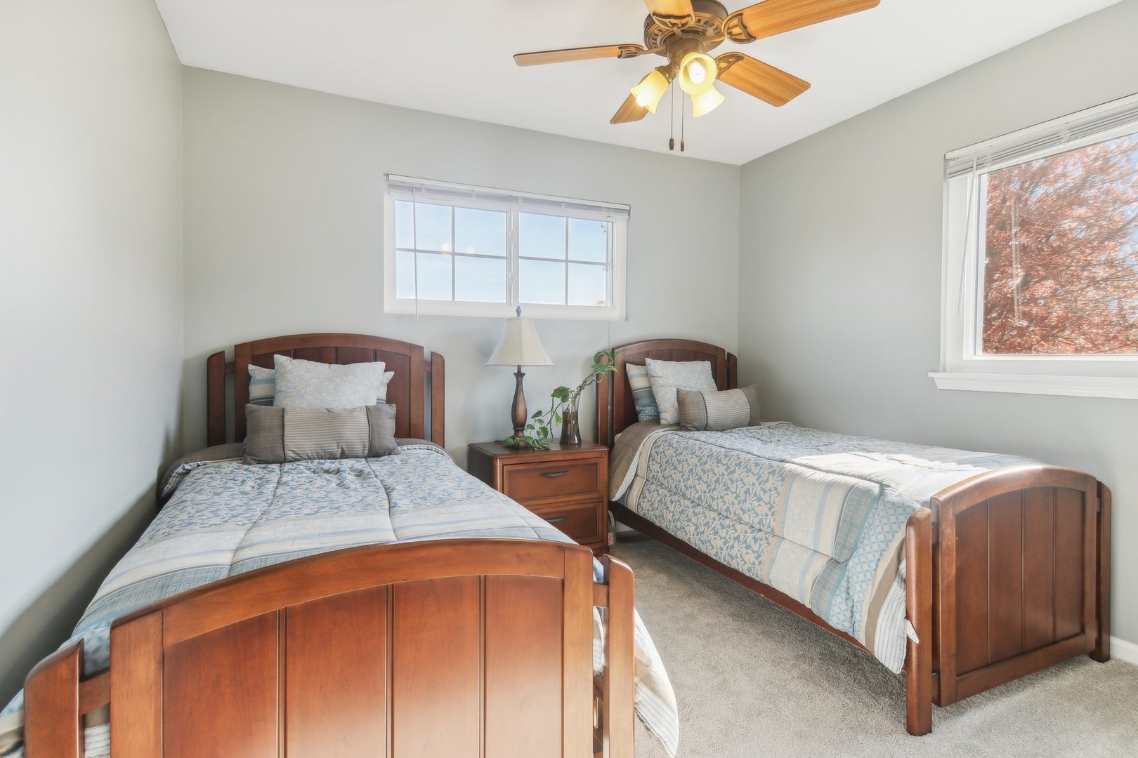 1907 Apple Valley Road Bolingbrook, IL 60490 - Photo 10 of 17 a bedroom with two beds and a chandelier