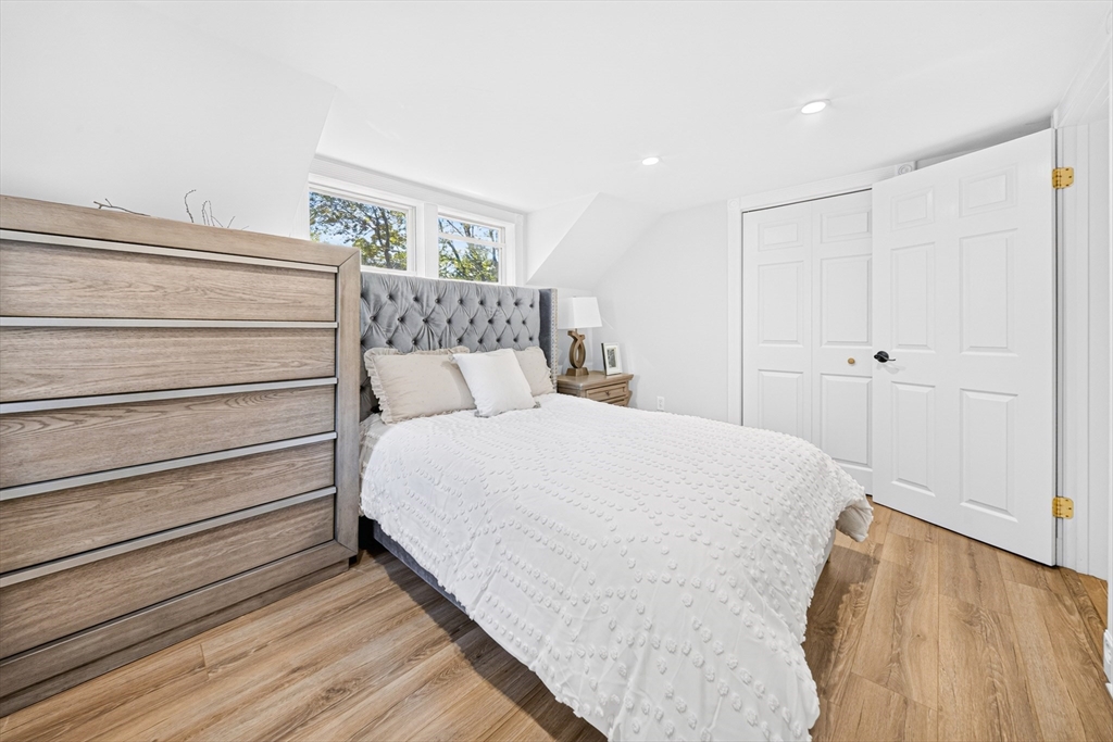 24 Miller Road Wilmington, MA 01887 - Photo 25 of 40 a large bed sitting in a bedroom next to a window