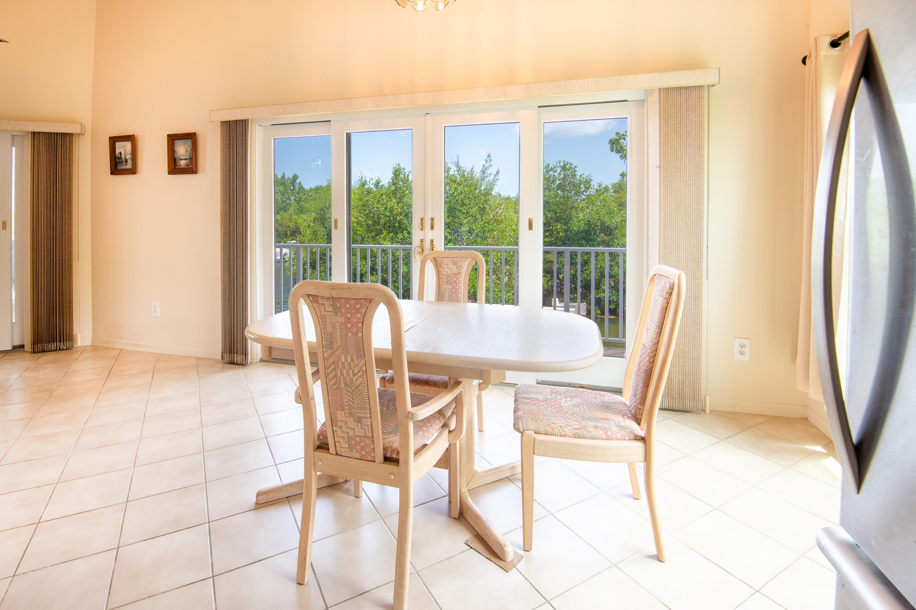 29015 Cedar Drive Big Pine Key, FL 33043 - Photo 11 of 38 a view of a dining room with furniture window and outside view