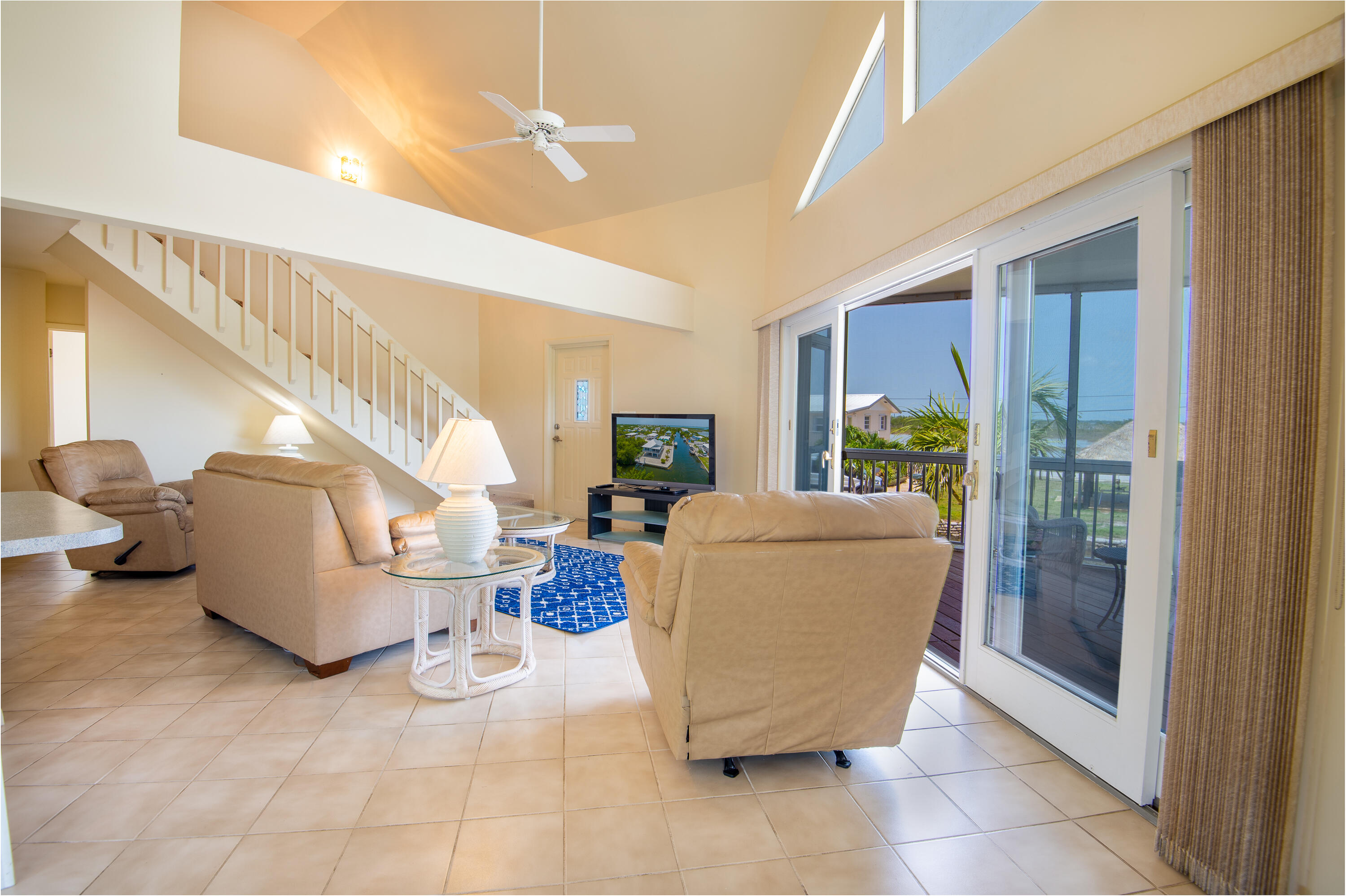 29015 Cedar Drive Big Pine Key, FL 33043 - Photo 12 of 38 a living room with patio furniture and a large window