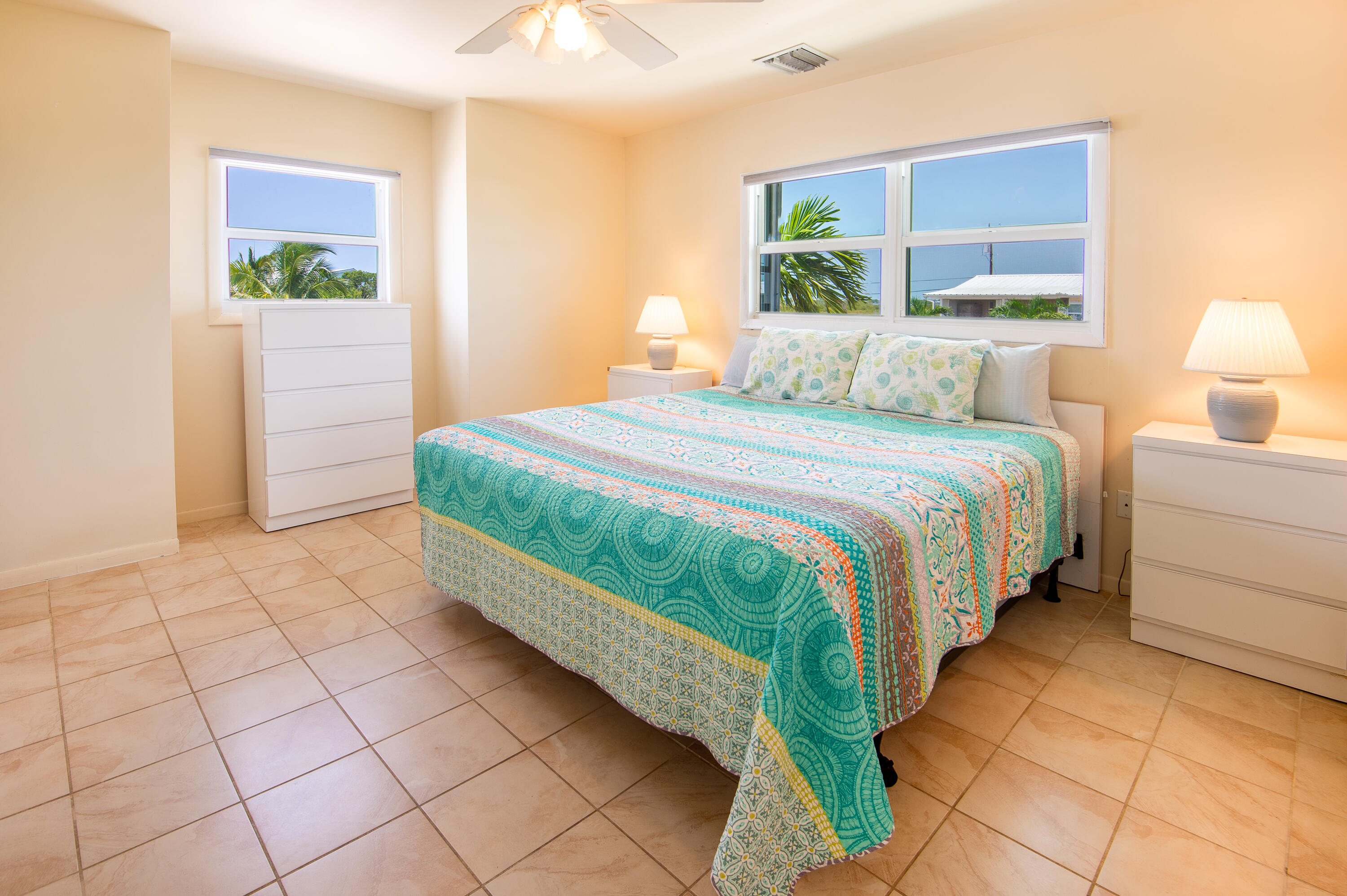 29015 Cedar Drive Big Pine Key, FL 33043 - Photo 16 of 38 a bedroom with a bed and a lamp