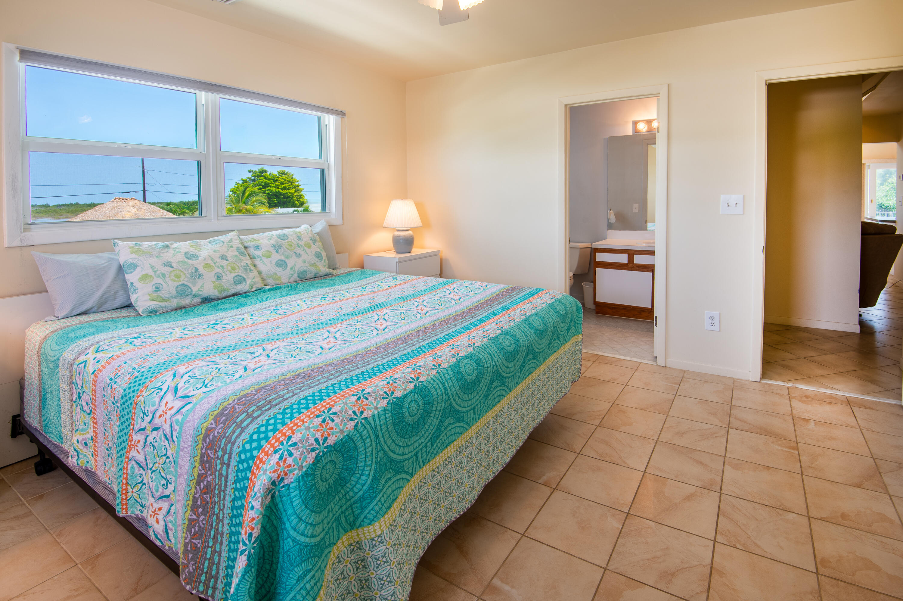 29015 Cedar Drive Big Pine Key, FL 33043 - Photo 17 of 38 a bedroom with a bed and a window
