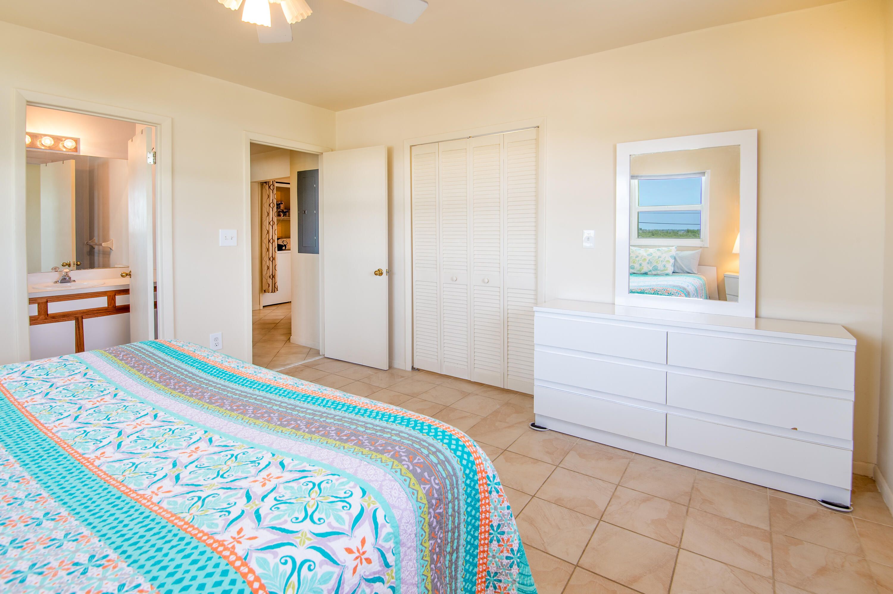 29015 Cedar Drive Big Pine Key, FL 33043 - Photo 18 of 38 a bedroom with a bed and a dresser in it