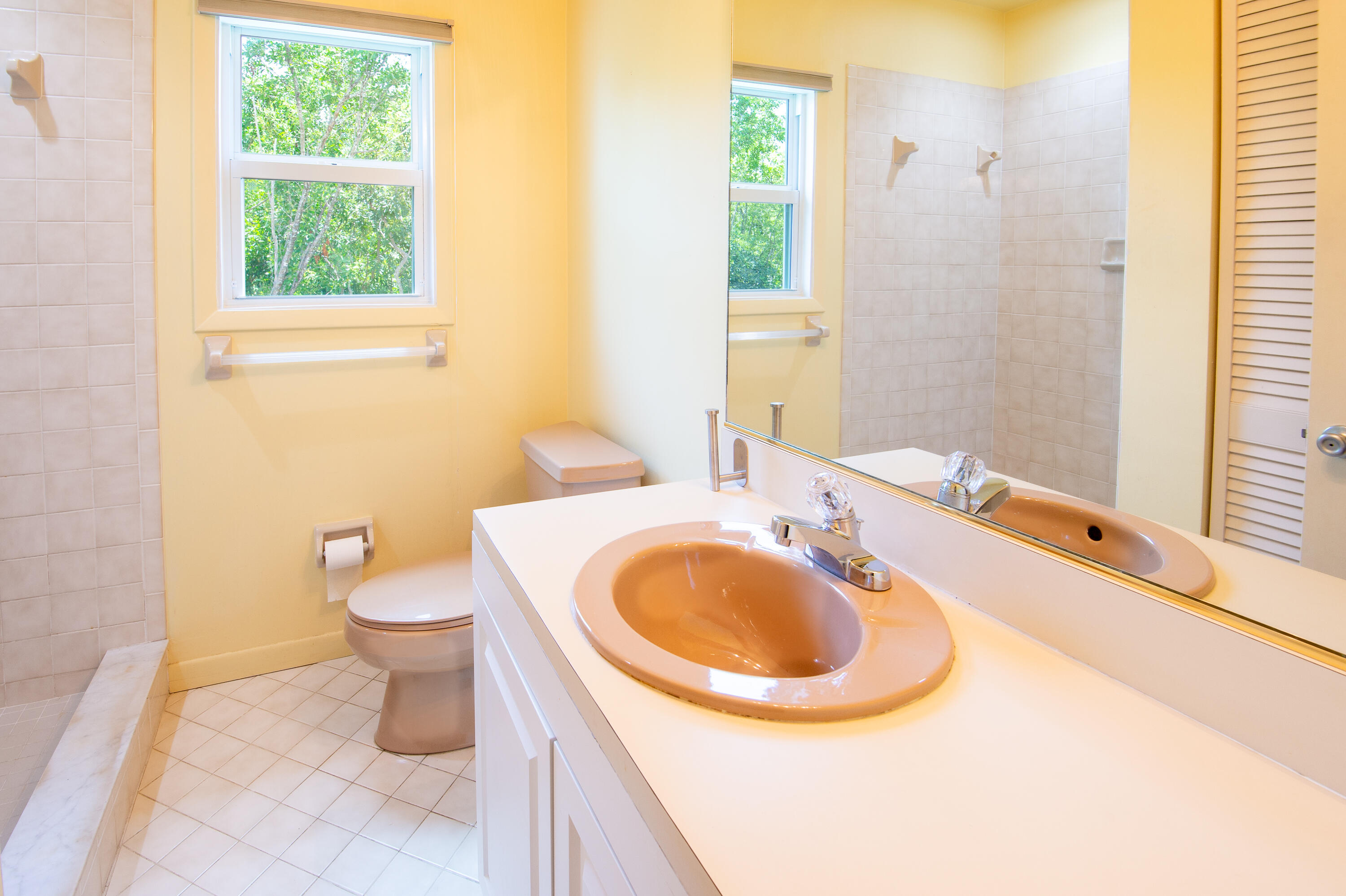 29015 Cedar Drive Big Pine Key, FL 33043 - Photo 22 of 38 a bathroom with a sink and a mirror