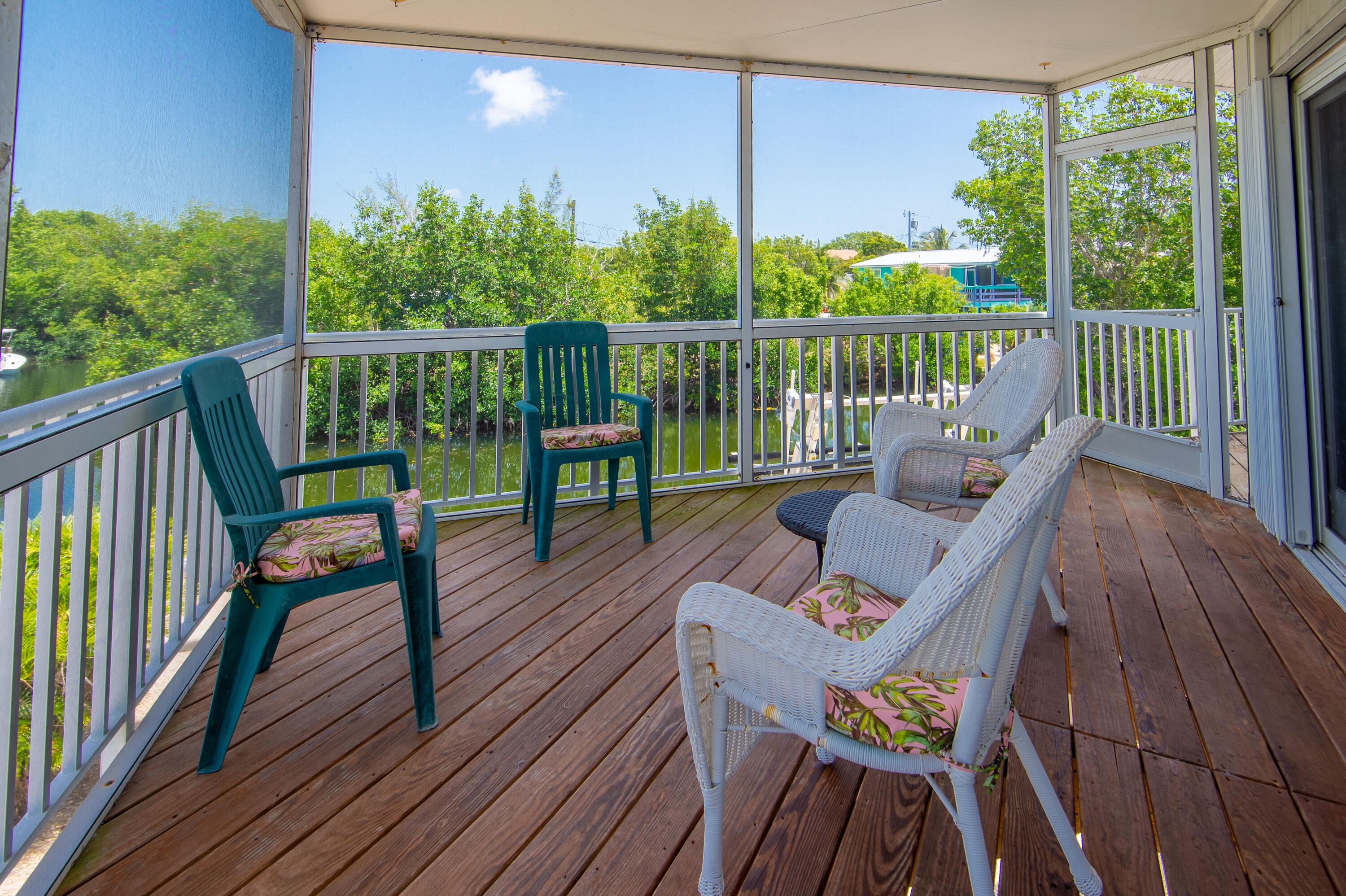 29015 Cedar Drive Big Pine Key, FL 33043 - Photo 26 of 38 a view of a deck with wooden floor and outdoor seating