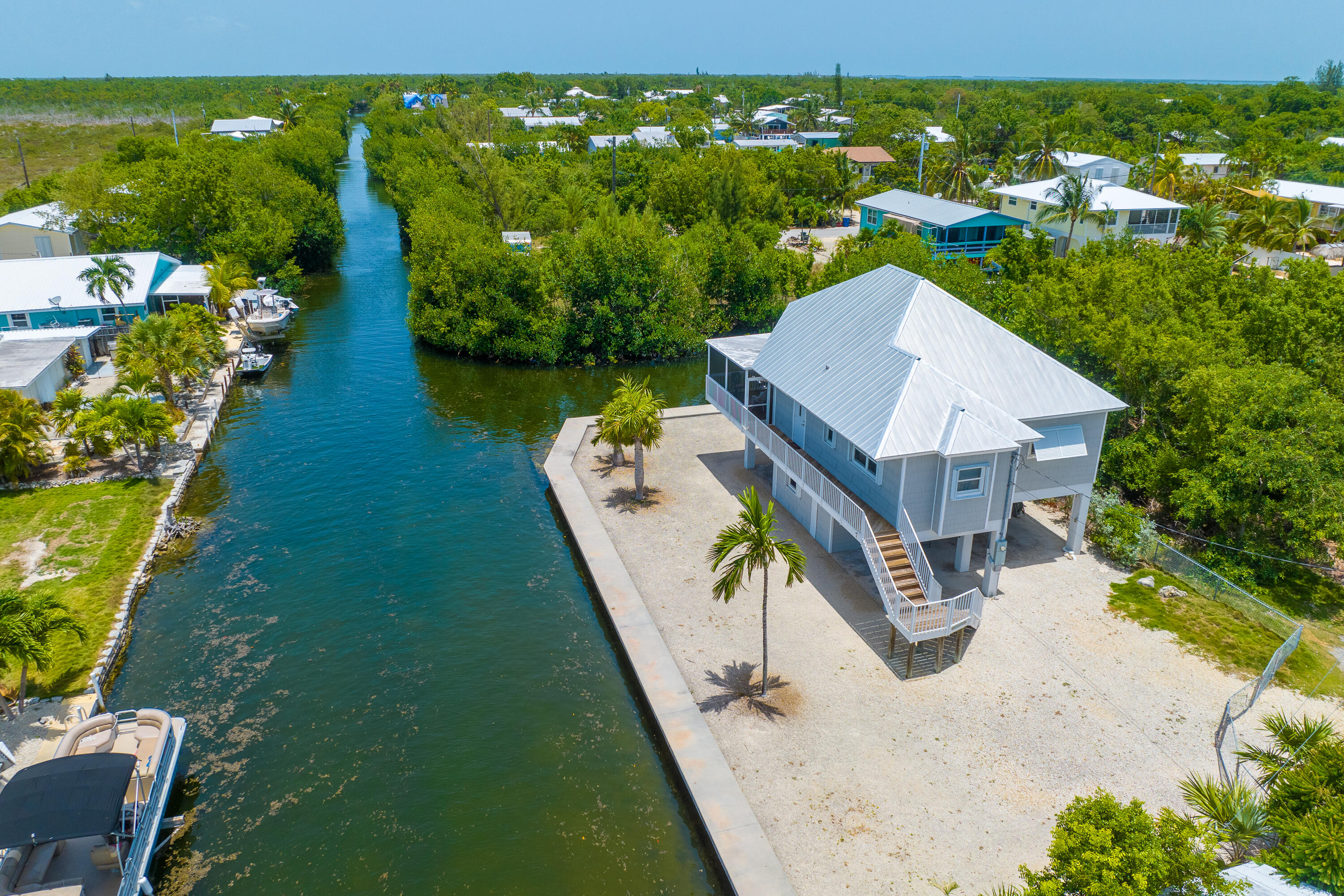 29015 Cedar Drive Big Pine Key, FL 33043 - Photo 3 of 38 a view of a house with a yard