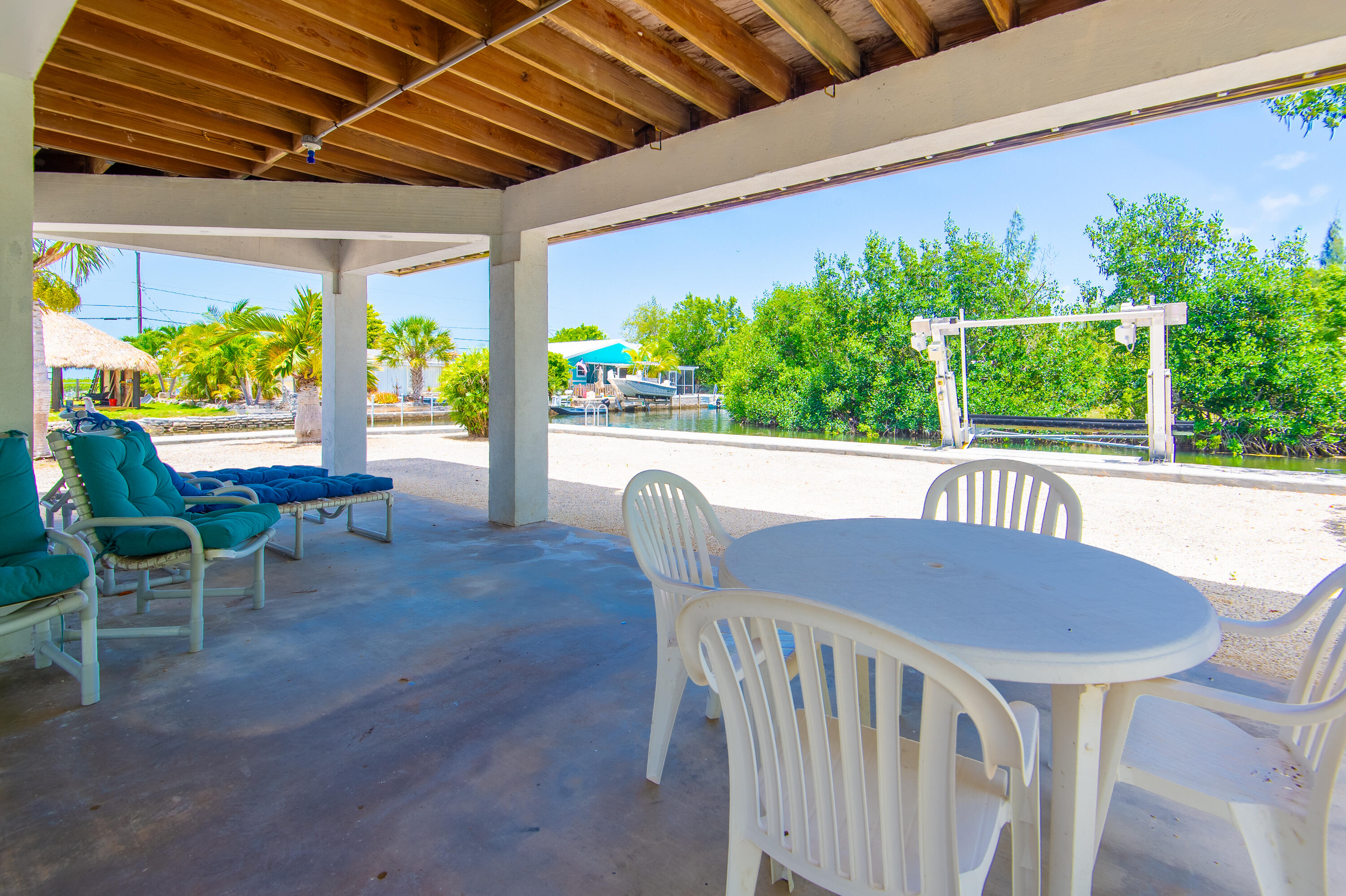29015 Cedar Drive Big Pine Key, FL 33043 - Photo 33 of 38 a view of a porch with furniture and a yard