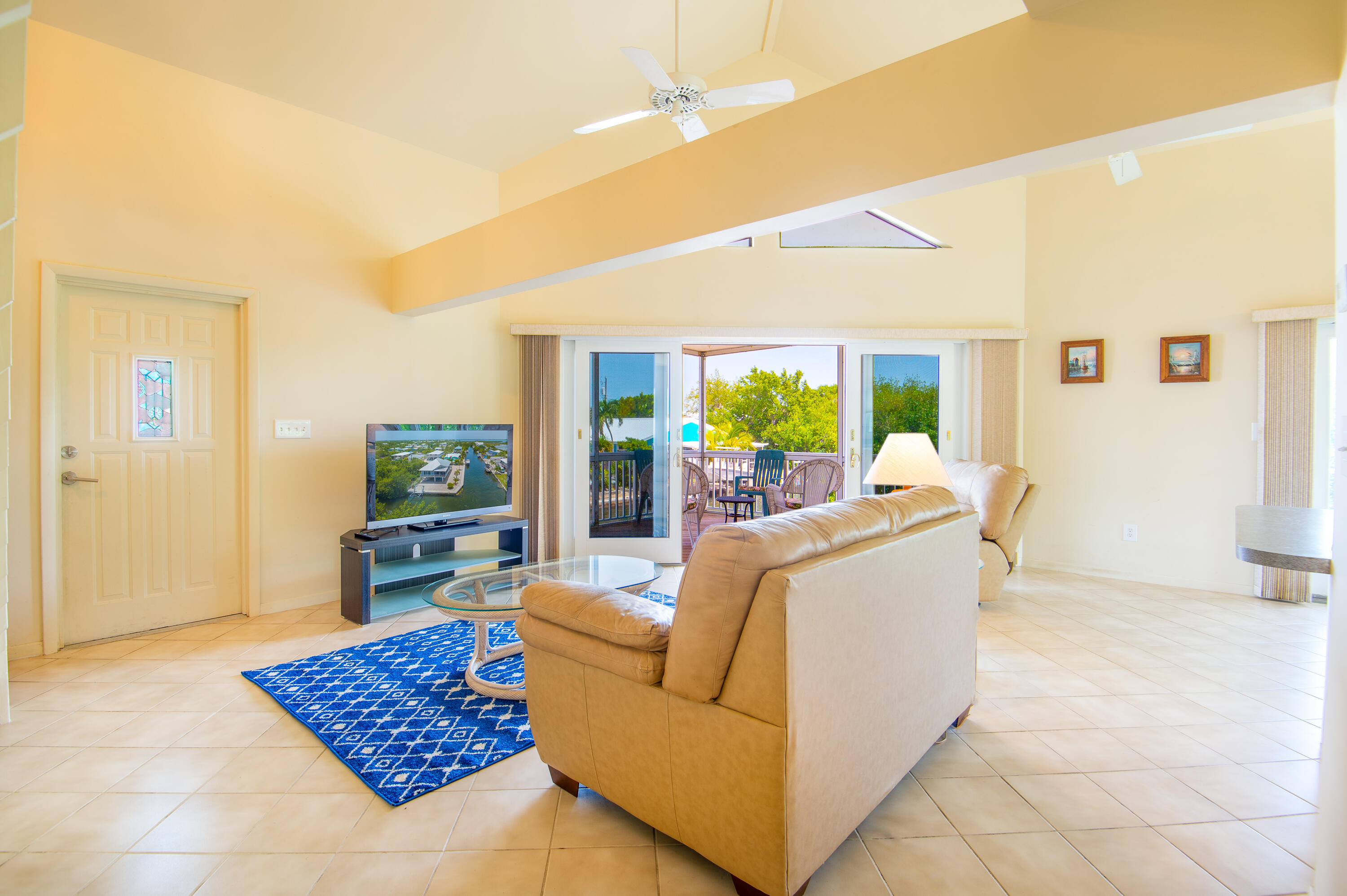 29015 Cedar Drive Big Pine Key, FL 33043 - Photo 7 of 38 a living room with furniture and a rug