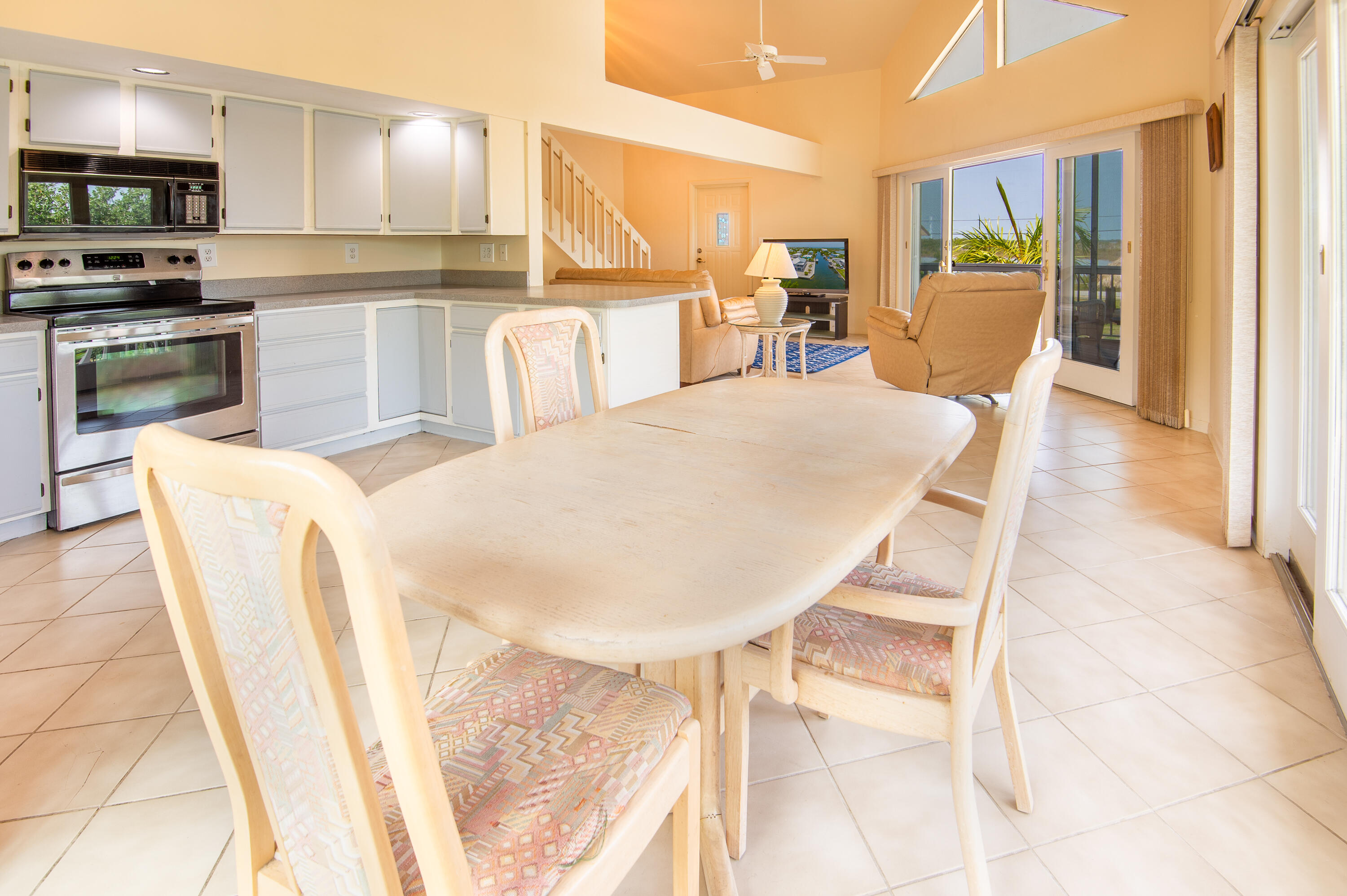 29015 Cedar Drive Big Pine Key, FL 33043 - Photo 10 of 38 a dining room with furniture and a kitchen view