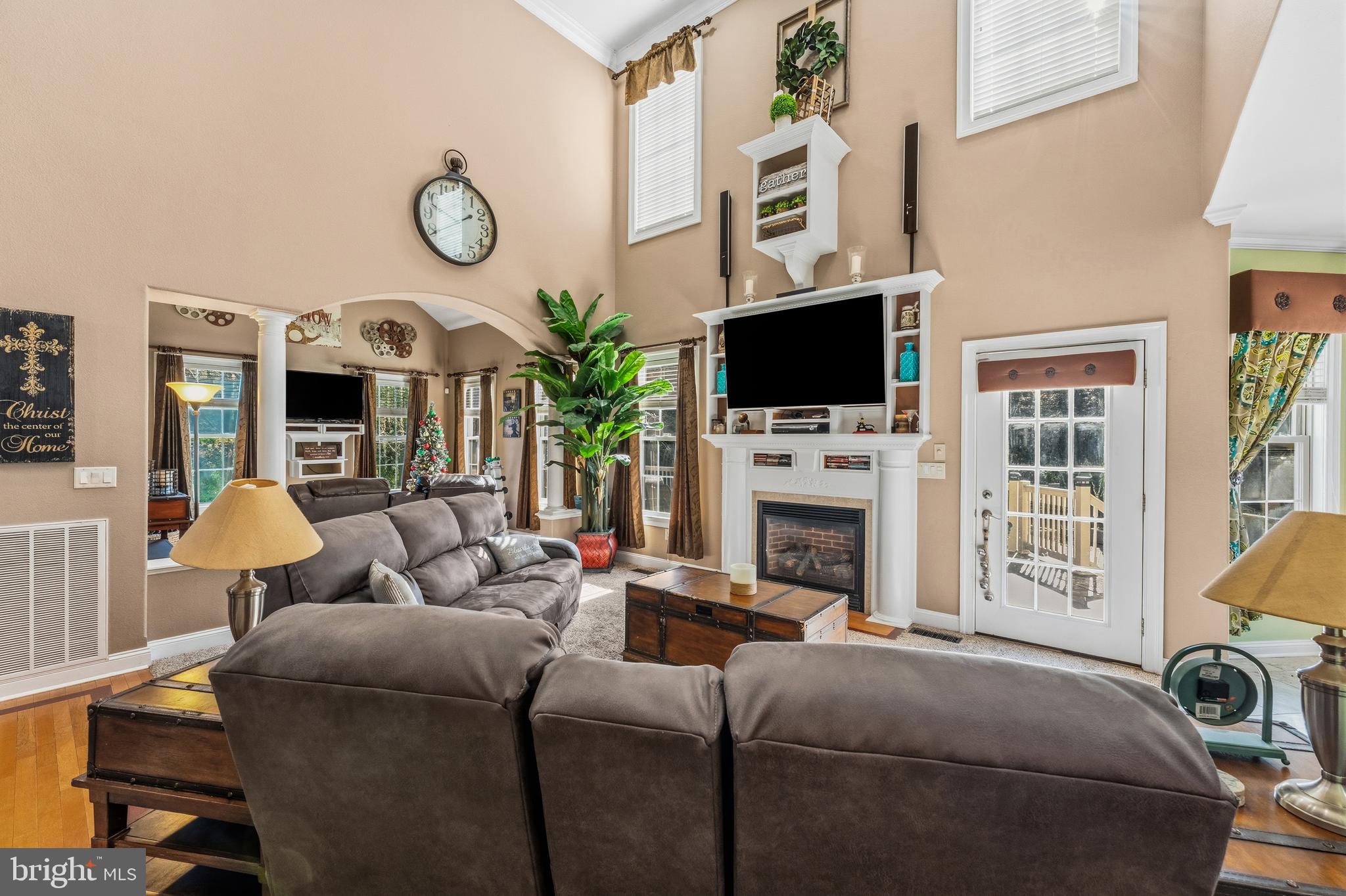 32383 Longridge Road Parsonsburg, MD 21849 - Photo 13 of 91 a living room with furniture a fireplace and a flat screen tv