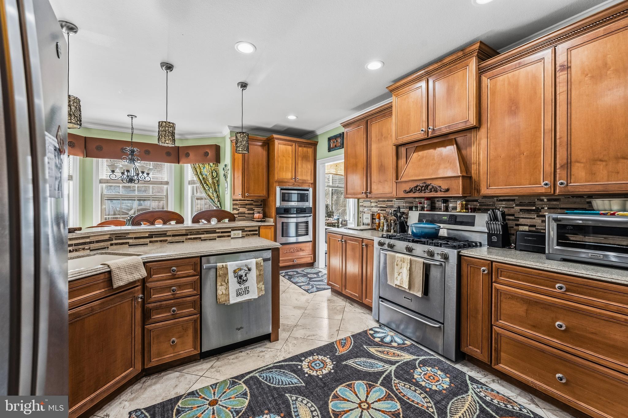 32383 Longridge Road Parsonsburg, MD 21849 - Photo 18 of 91 a kitchen with stainless steel appliances granite countertop a stove a sink and a microwave