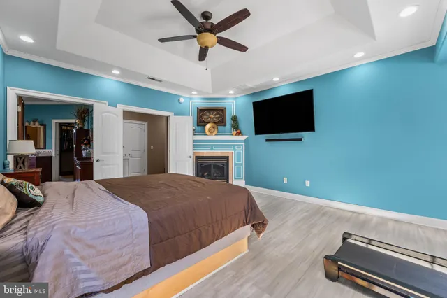 a large white kitchen with cabinets and a stove top oven