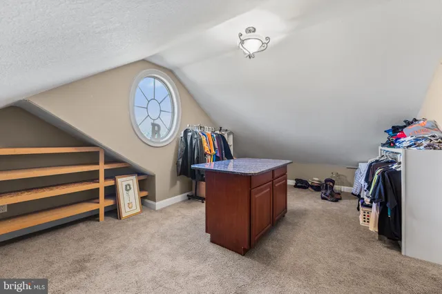 a living room with lots of furniture and a chandelier