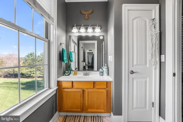 a kitchen with granite countertop a sink stainless steel appliances and counter space