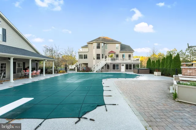 a kitchen with stainless steel appliances a refrigerator and a counter top space