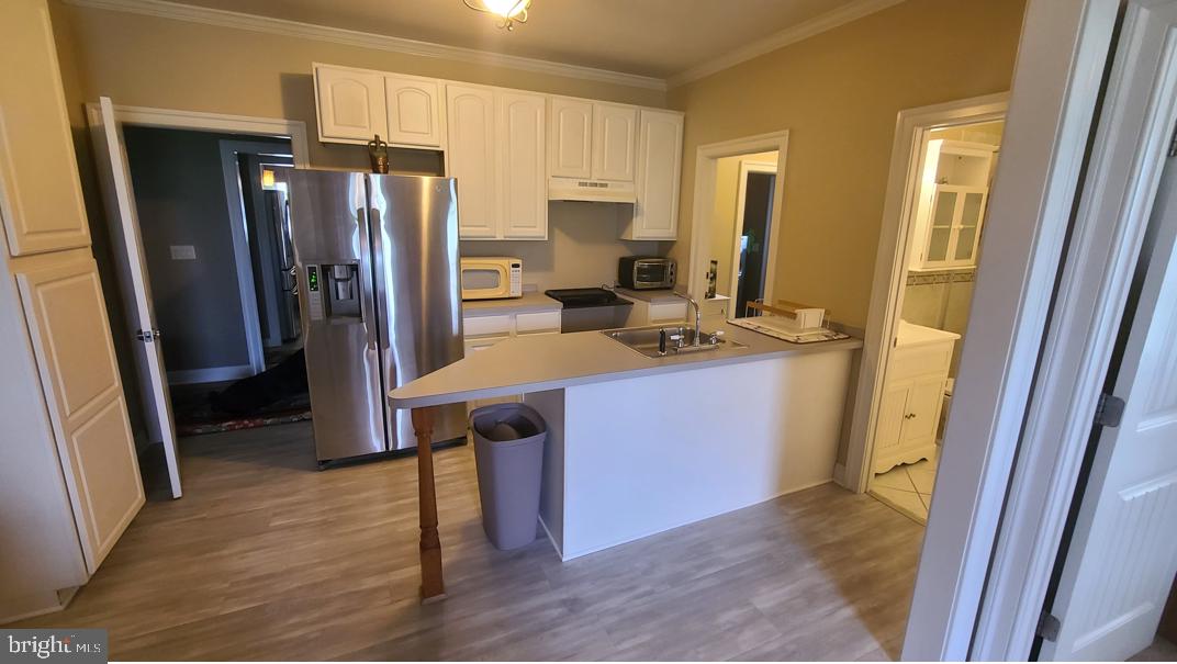 32383 Longridge Road Parsonsburg, MD 21849 - Photo 57 of 91 a kitchen with a refrigerator a stove and a sink