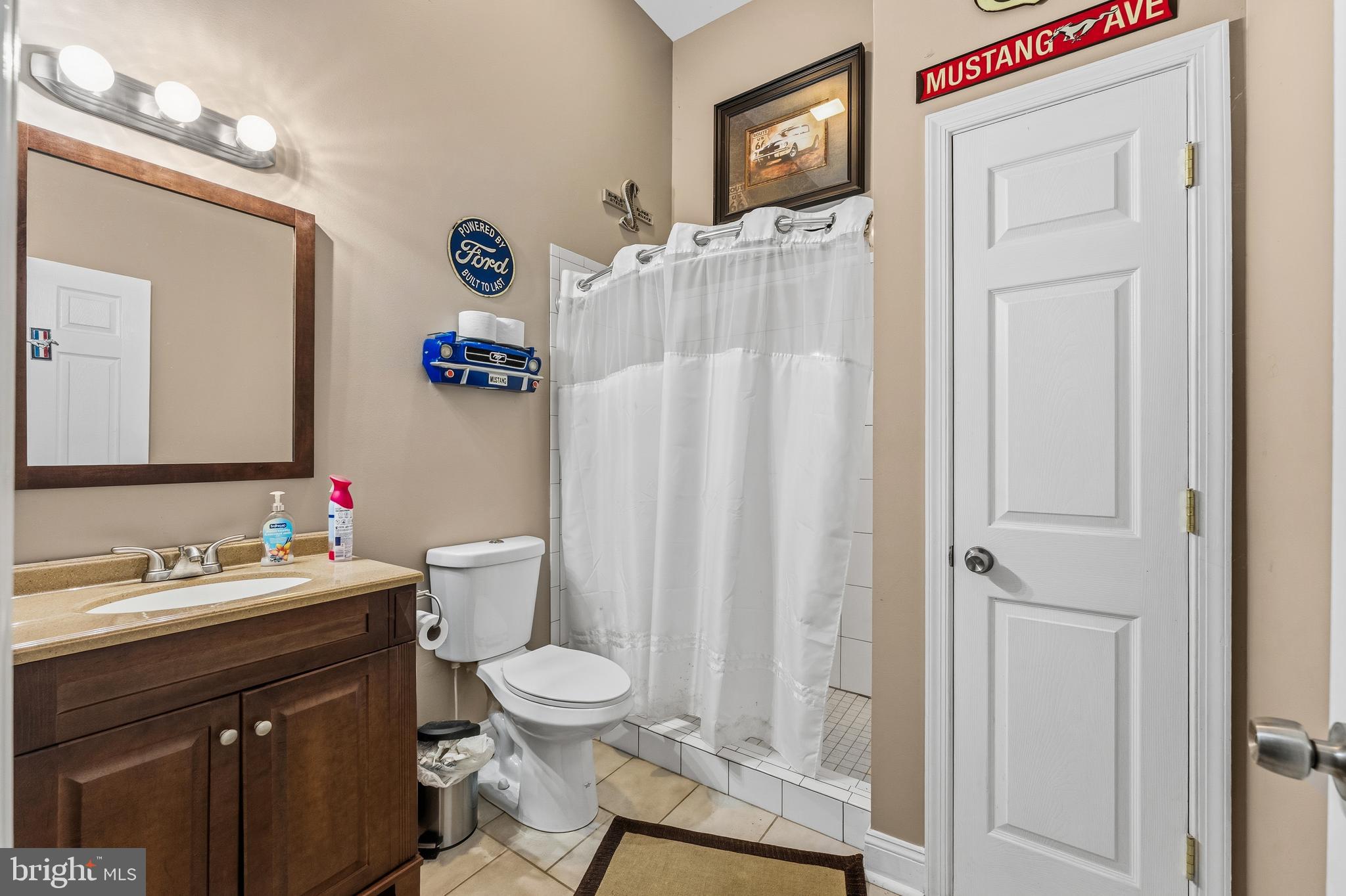 32383 Longridge Road Parsonsburg, MD 21849 - Photo 68 of 91 a bathroom with a sink vanity mirror and toilet