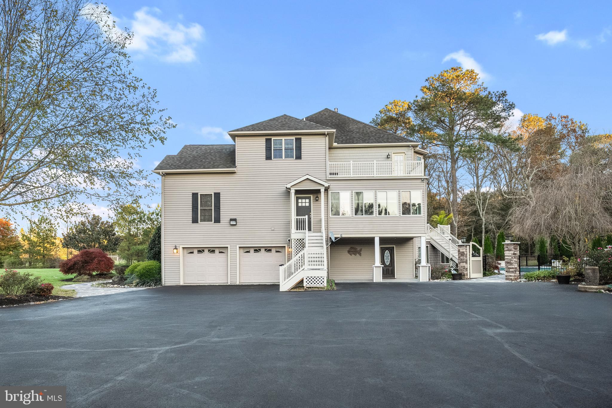 32383 Longridge Road Parsonsburg, MD 21849 - Photo 87 of 91 a view of a white house with a large tree and a yard