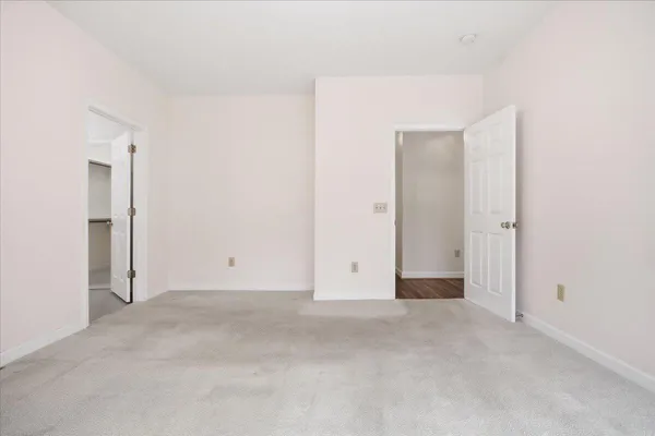 a view of a bathroom from the hallway