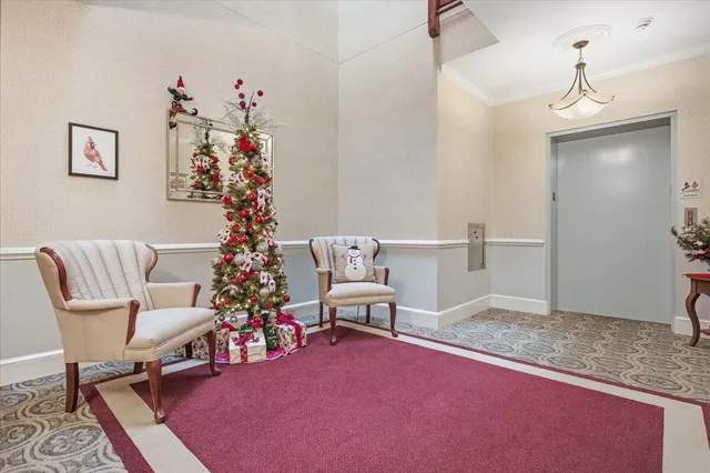 a view of a house with a yard and sitting area