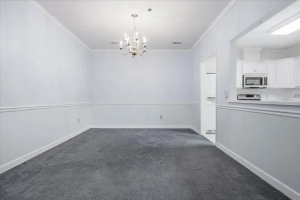 an empty room with mirror