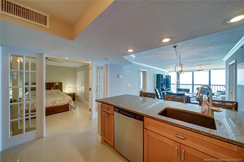 8800 South Ocean Drive, Unit 905 Jensen Beach, FL 34957 - Photo 11 of 67 a kitchen with sink and window