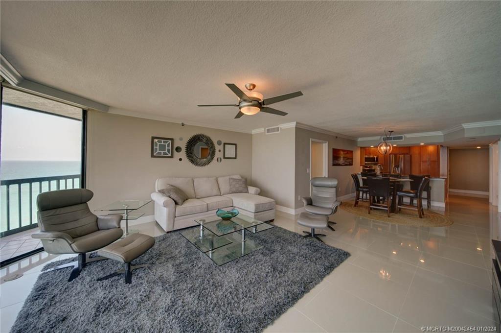 8800 South Ocean Drive, Unit 905 Jensen Beach, FL 34957 - Photo 20 of 67 a living room with furniture and a table