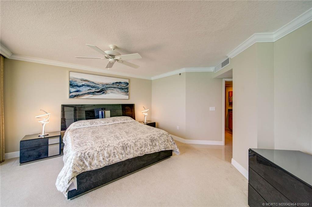 8800 South Ocean Drive, Unit 905 Jensen Beach, FL 34957 - Photo 25 of 67 a bedroom with a bed and window