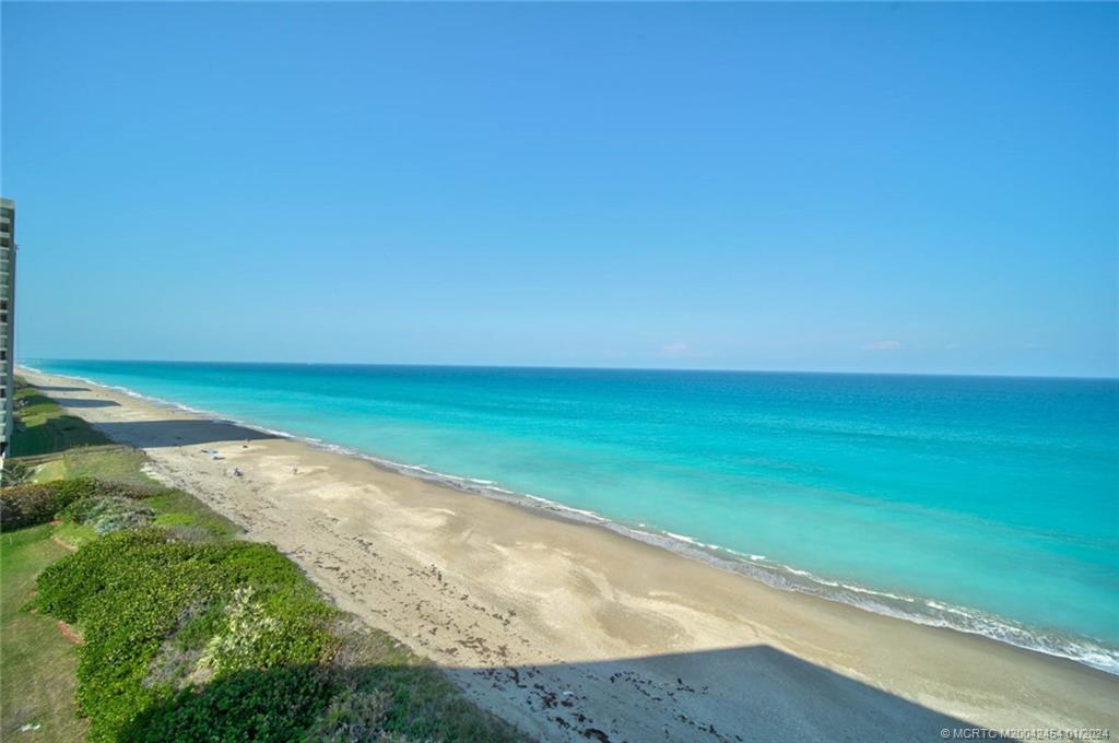 8800 South Ocean Drive, Unit 905 Jensen Beach, FL 34957 - Photo 3 of 67 a view of a beach with an ocean view