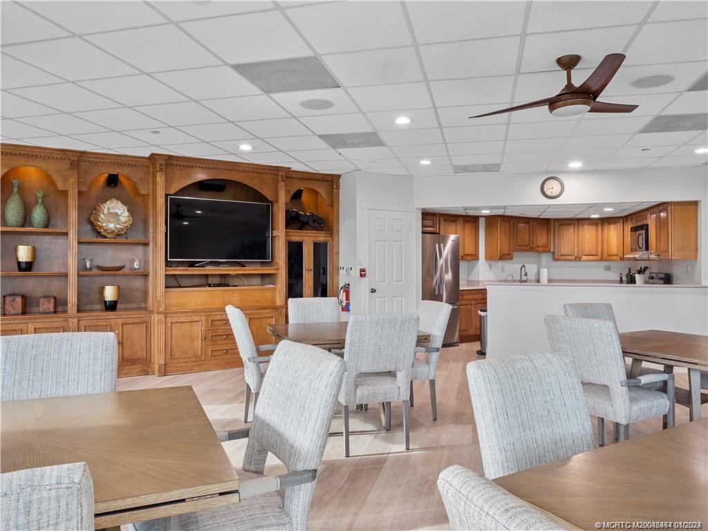 8800 South Ocean Drive, Unit 905 Jensen Beach, FL 34957 - Photo 65 of 67 a living room with furniture and a flat screen tv