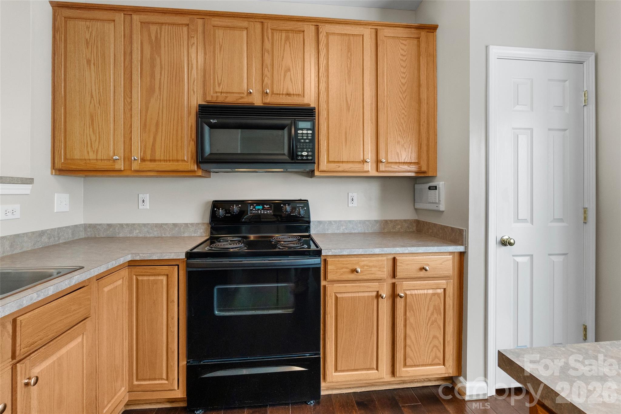 104 Rock Ridge Lane Mount Holly, NC 28120 - Photo 21 of 48 a kitchen with stainless steel appliances granite countertop a stove and a microwave