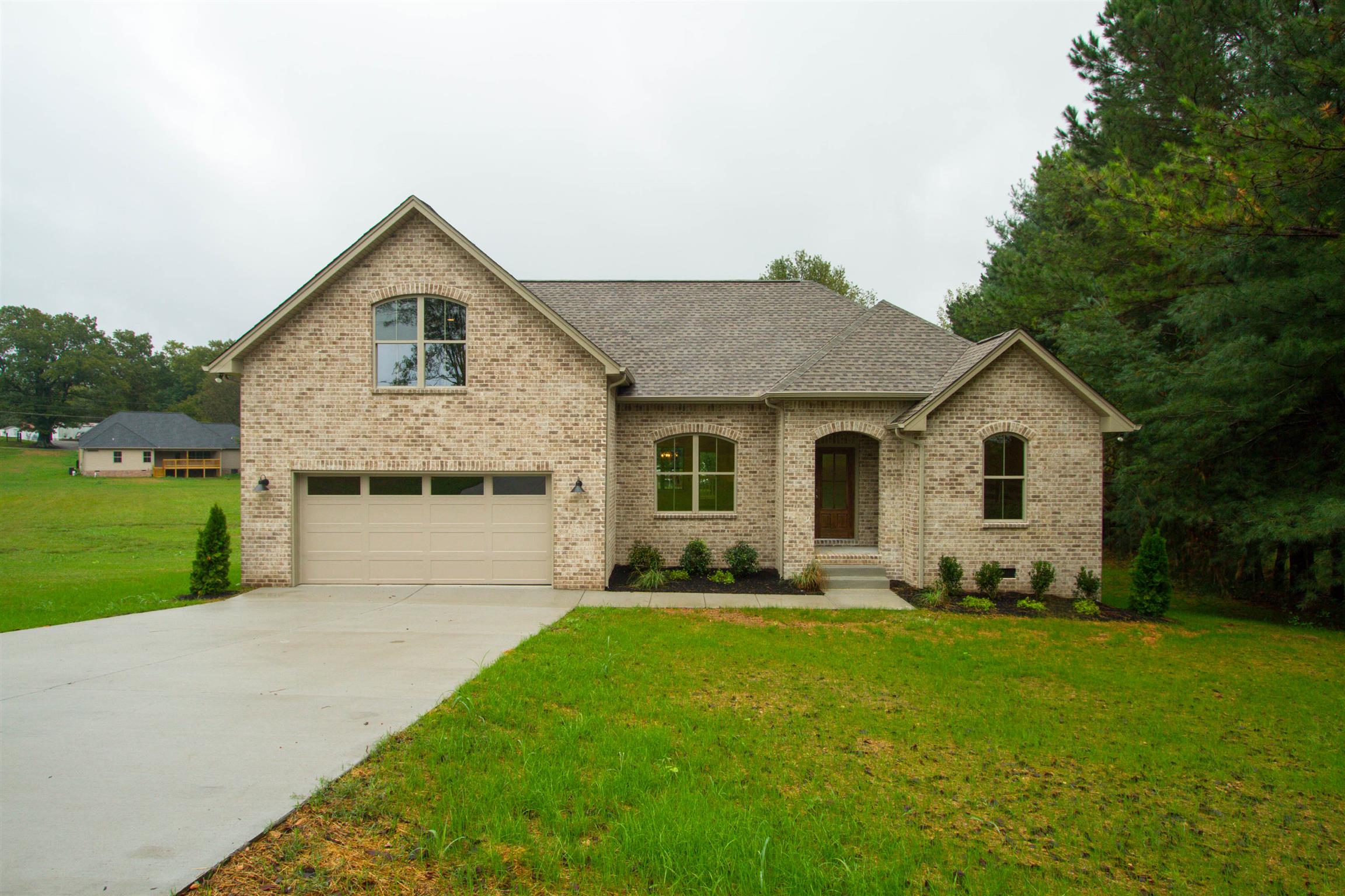 4121 Airport Road Springfield, TN 37172 - Photo 1 of 30 a front view of a house with a yard and trees